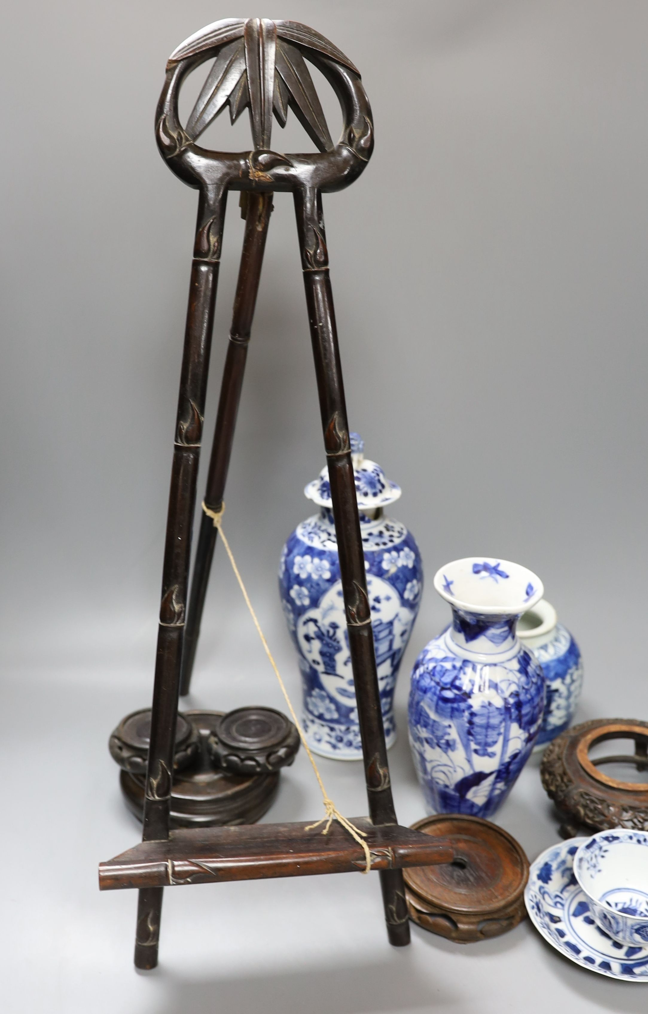 A Chinese Kangxi style teabowl and saucer, other oriental ceramics, carved hardwood easel, etc.